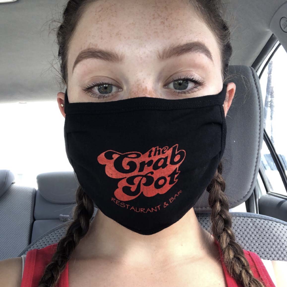 Author Ella Shairo wearing a face mask