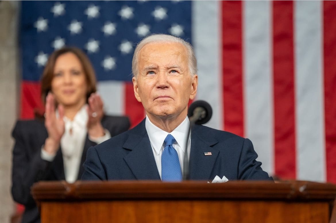 President Biden stands at a lectern during the State of the Union address, 2024.